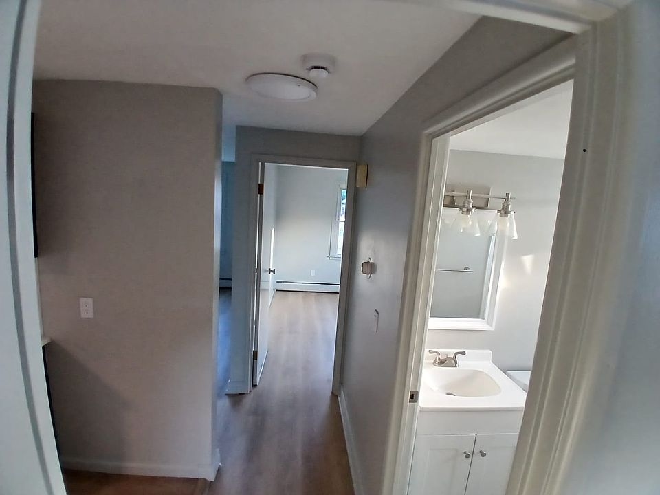 Hallway, Nice Open Floor Plan with Living Room Adjacent to Kitchen and Bedrooms on opposite ends of Hallway