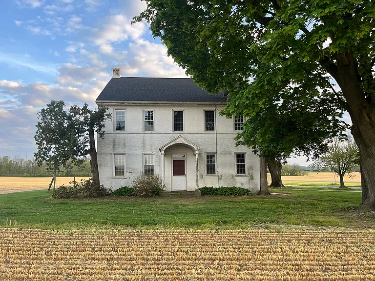 Front of home but entrance on the side