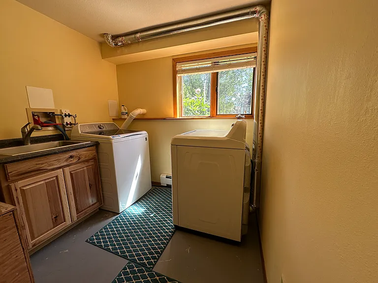 Laundry room with washer, dryer and sink