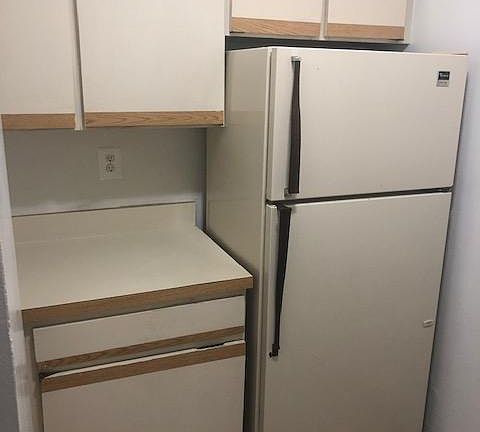 Kitchen with full sized fridge