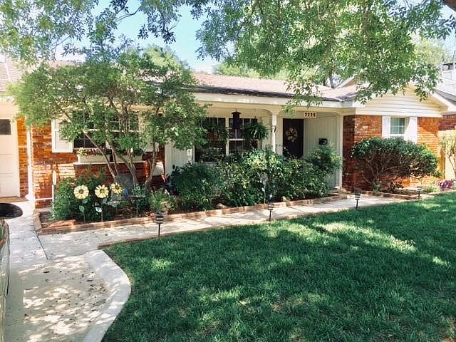Darling home in the Village with lots of curb appeal