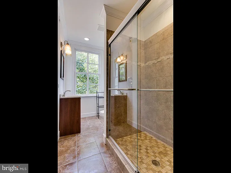 Full bath off the front of the home with large shower.