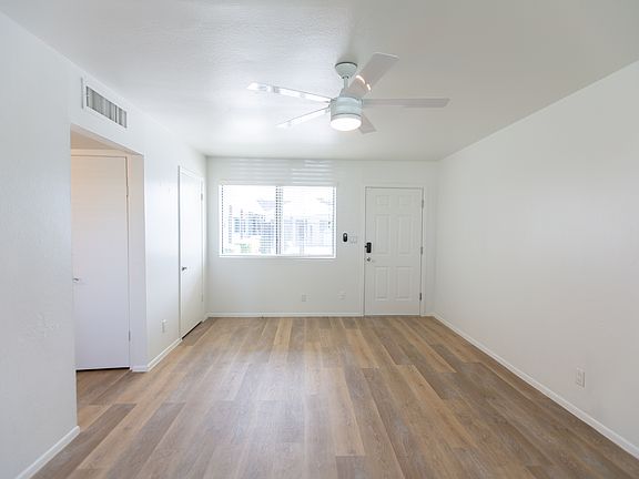 Large living space with wood look flooring