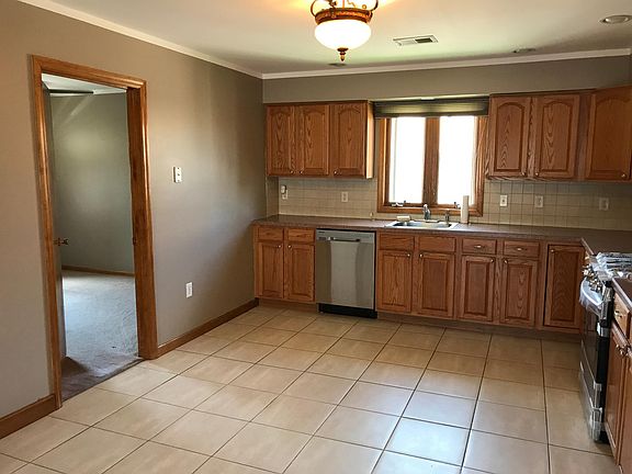 view into office/4th bedroom from kitchen