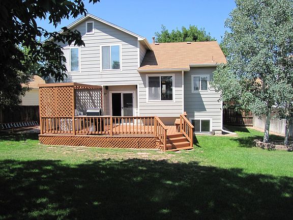 Back of house with deck