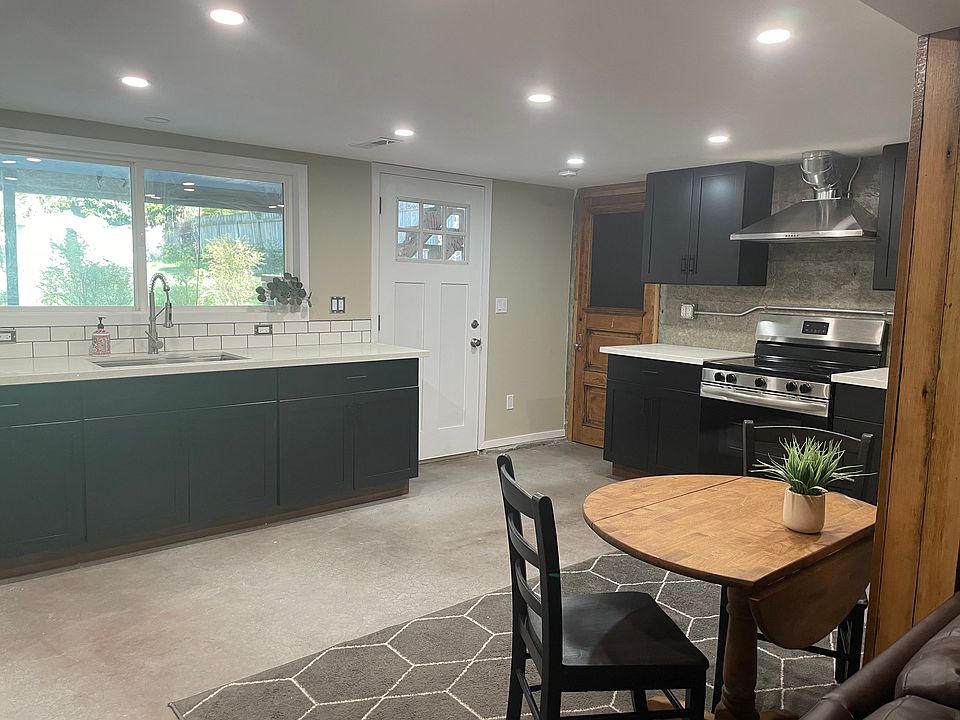 Kitchen with plenty of daylight and view of garden and yard