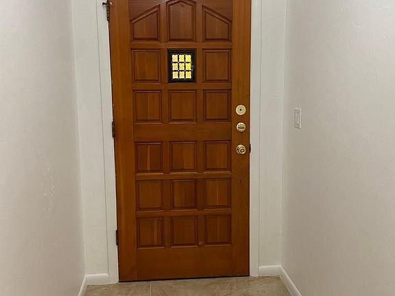 Interior of front door with glass window opening