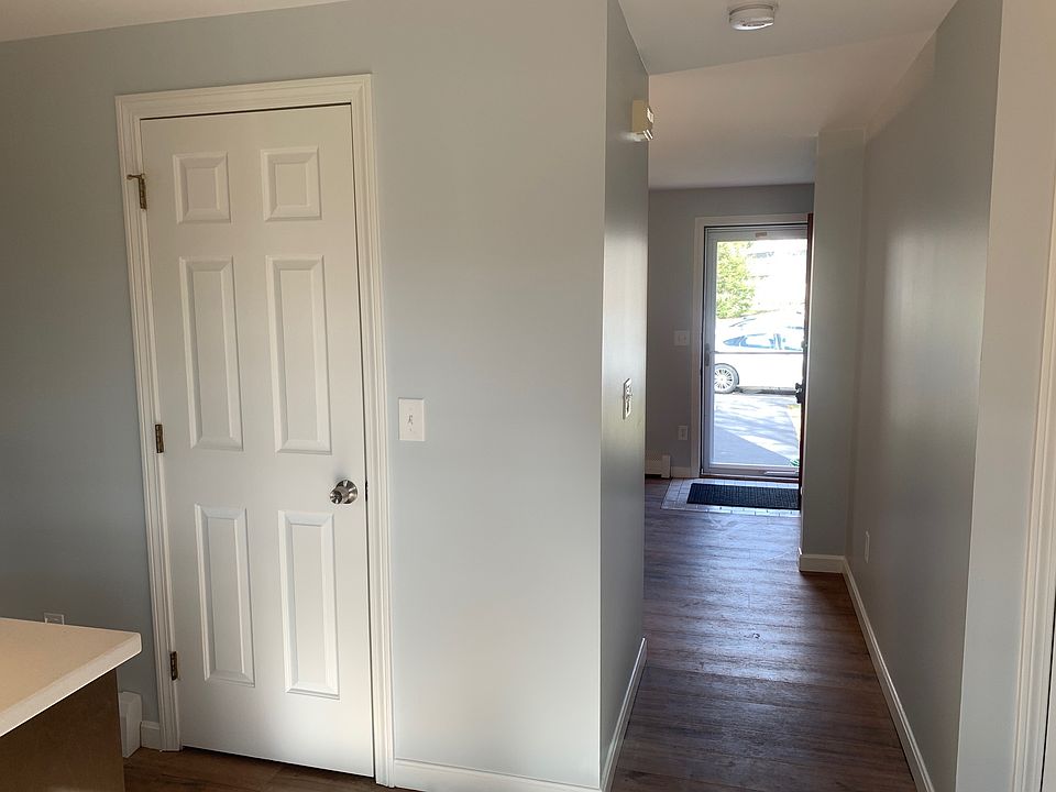 Hallway living room to kitchen and half bath.