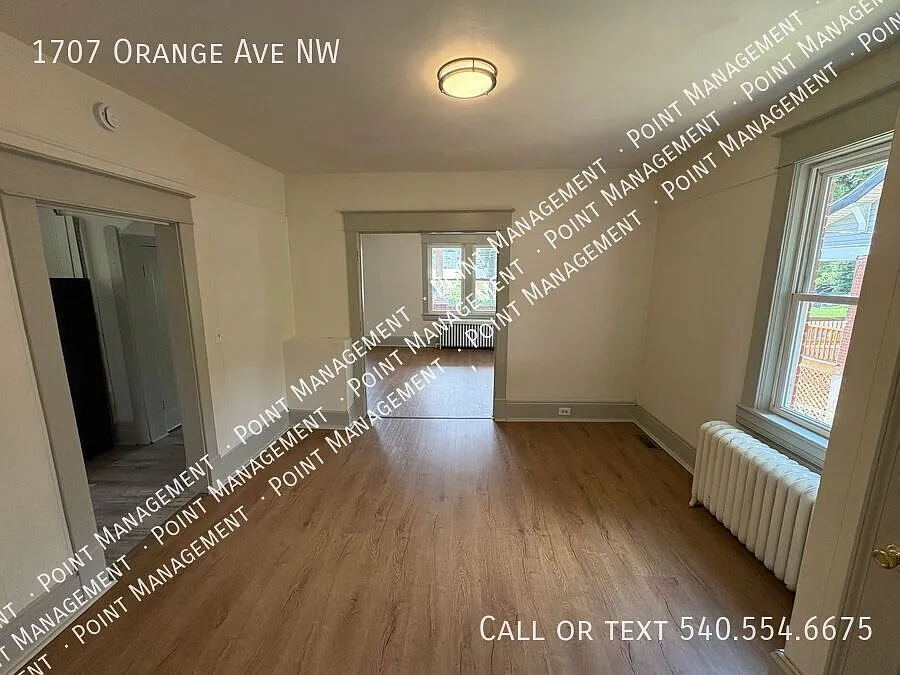 Charming 4-Bedroom Brick Home with Porch, Yard & Hardwood Floors — Photo 3