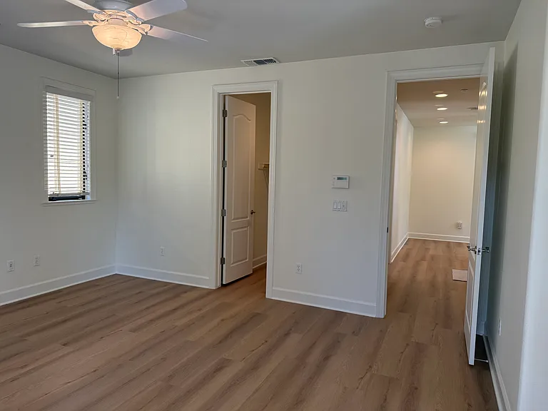 Primary bedroom has a patio door that opens a balcony overlooking the community green belt. Primary bedroom features 2 walk-in closets with tastefully appointed in-suite bathroom with 2 sinks, a whirlpool bathtub and a shower stall with glass enclosure.