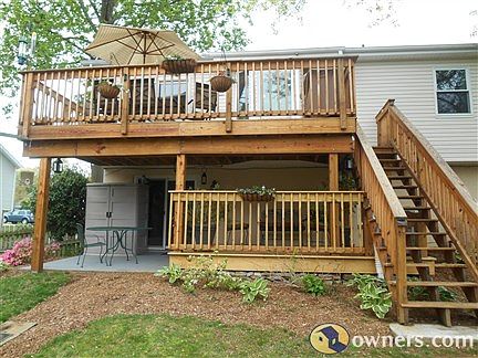 Double level deck with concrete patio on lower level