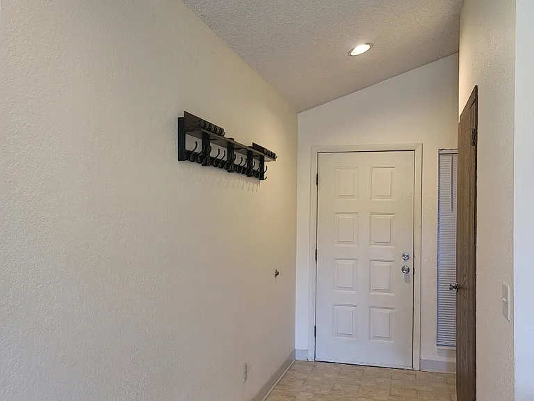 Entry - laundry to the right, then coat closet, next is the kitchen
