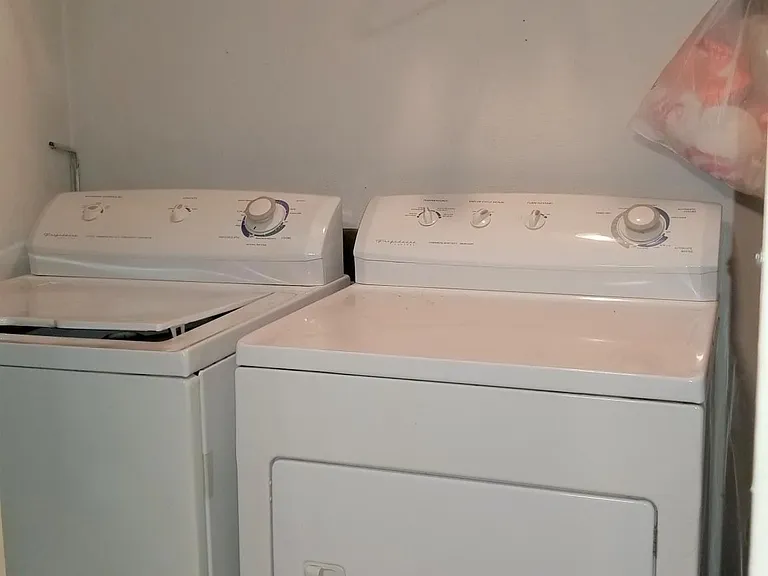 In-unit washer and dryer with shelving
