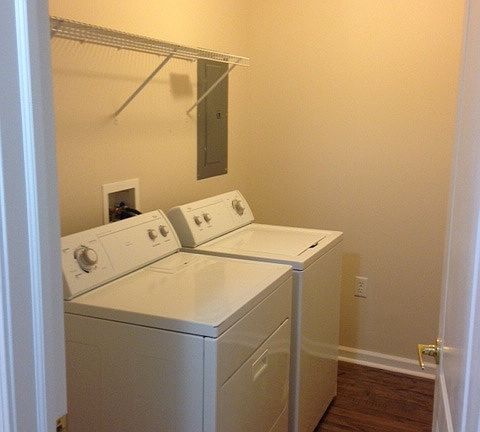 laundry room with washer dryer included
