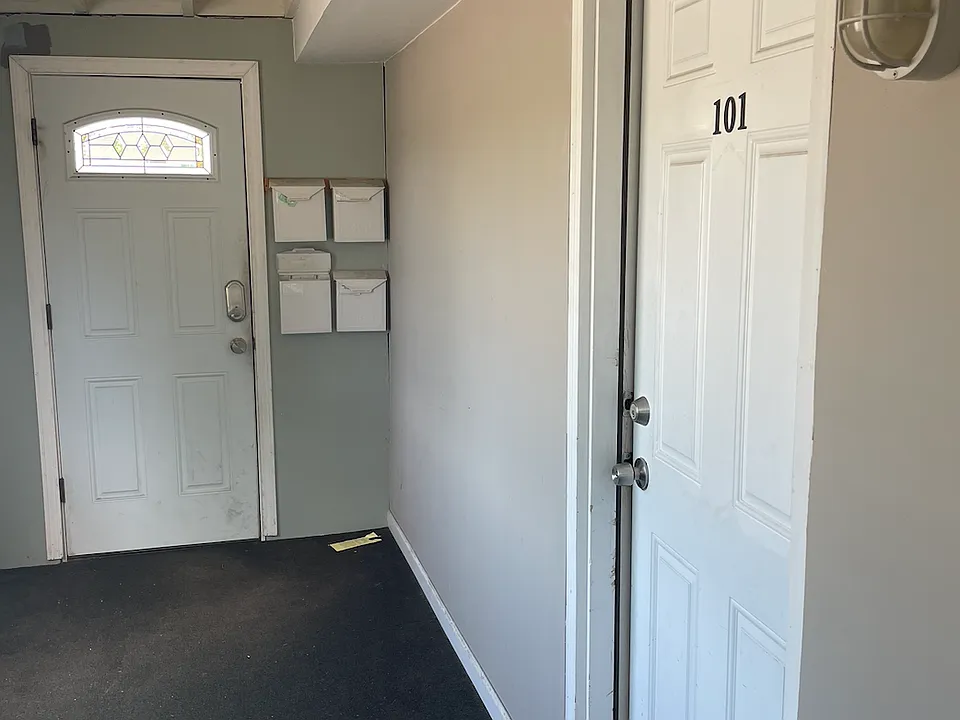 common hallway door with mail