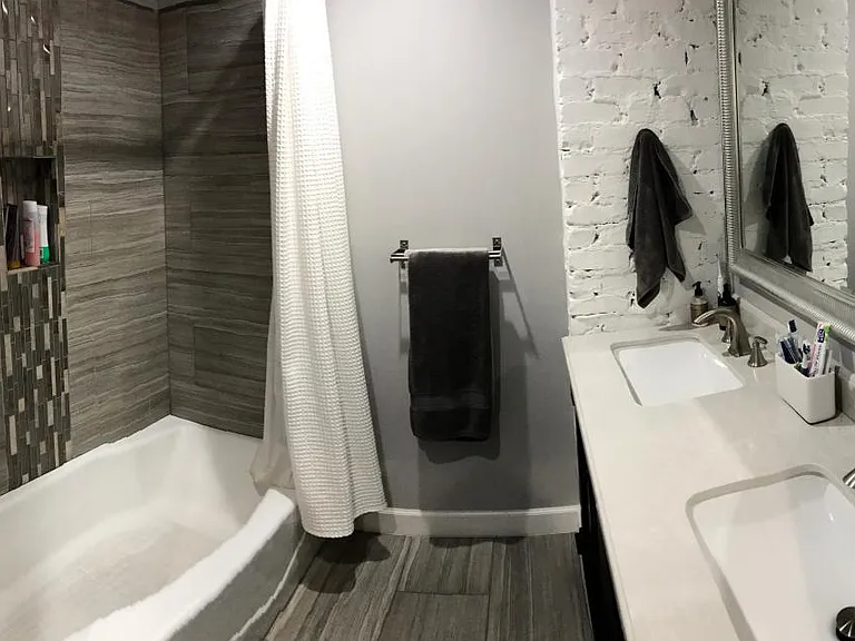 Bathroom with double sink, brushed nickel, soft close cabine