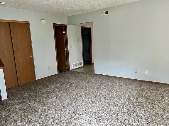 Living room with connection to dining room/kitchen
