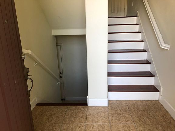 Entrance (left to basement and garage; right to 2nd and 3rd floors)