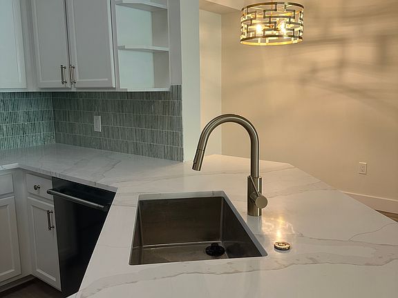 Stunning Kitchen with High end stainless appliances and quartz counter tops