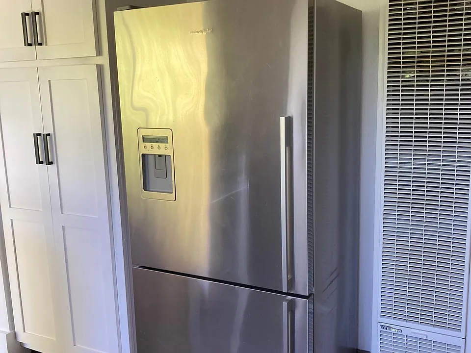 Pantry. refrigerator and wall furnace.