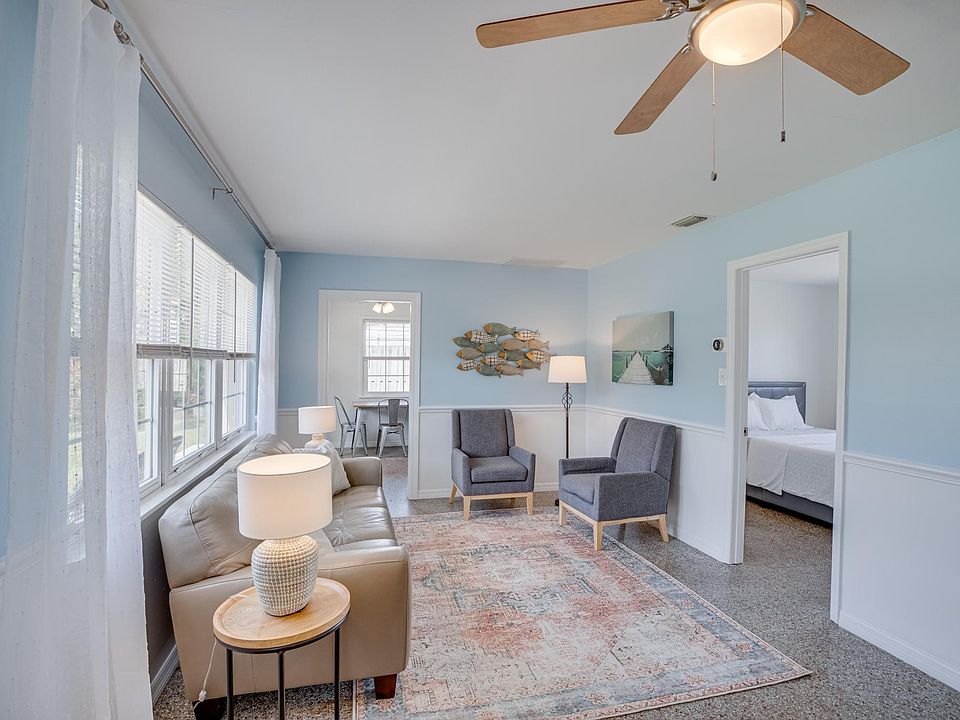 Furnished spacious living room adjacent to bedrooms