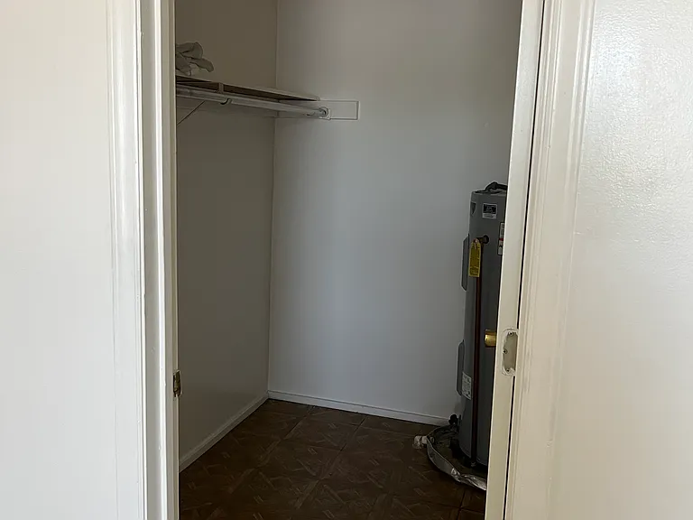 Walk-in closet located in bedroom