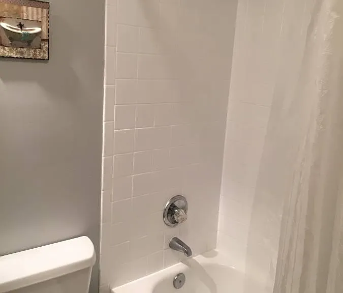 Bathroom adjoining bedroom.