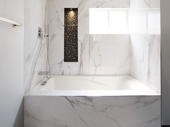 Plenty of bathroom storage is available, including a floor-to-ceiling linen closet located to the right of the bathtub_perfect for storing towels, extra linens, toiletries, and cleaning supplies in one convenient spot.