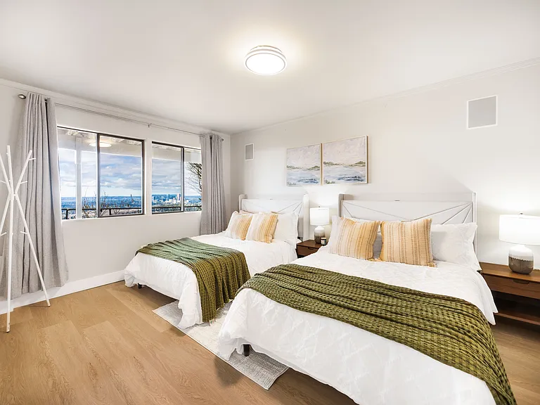 The master bedroom includes comfortable full size beds with 2 wooden bedside tables_a pure white hanger for you to hang ur clothes and bags.