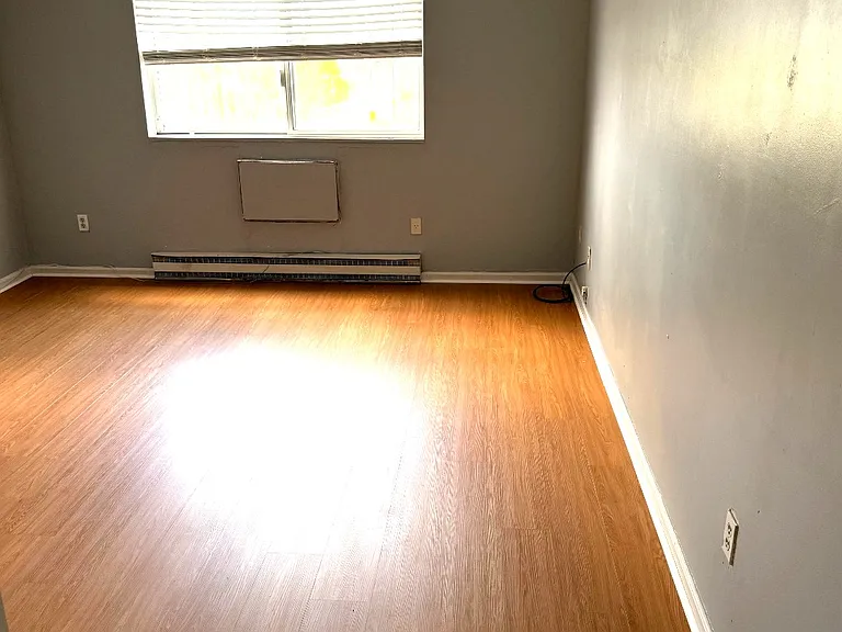 Bedroom with great natural light and updated flooring