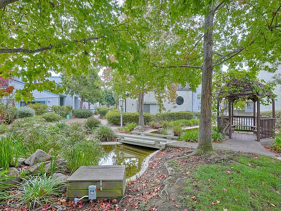 Condo looks out on pond and green space.