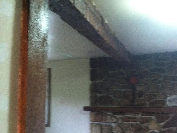 Large rafter between kitchen/living room