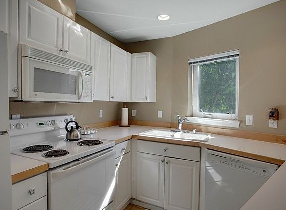 Bright kitchen with plenty of storage and counter space.