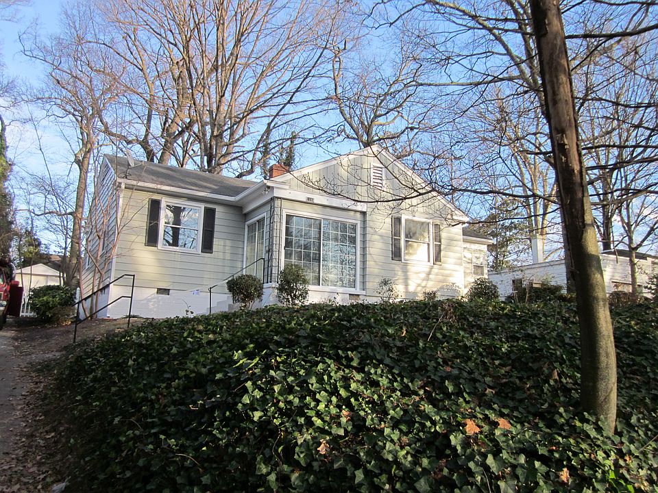 Front yard includes garden area and beautiful ivy ground cover