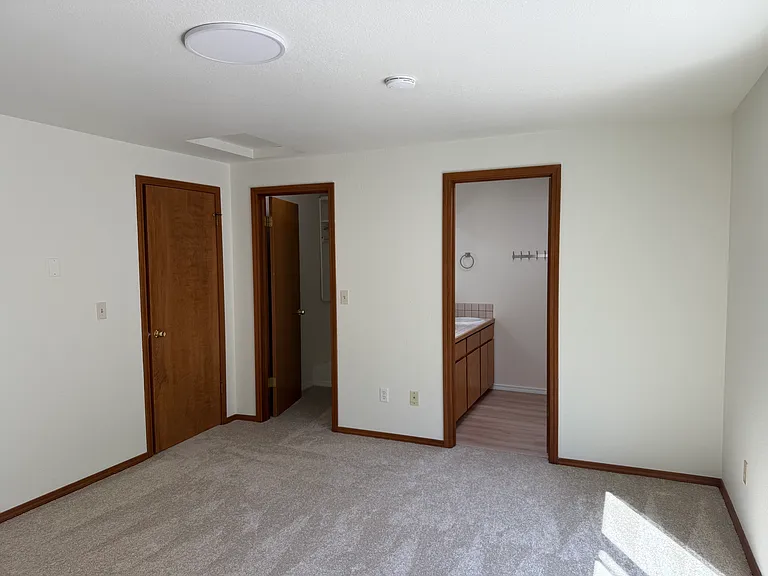 Main bedroom showing Main bath and walk-in closet
