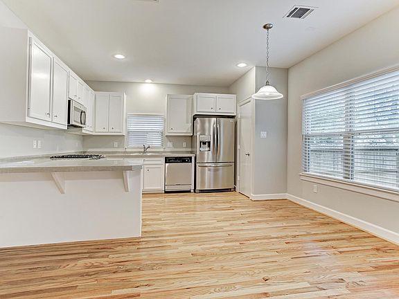 This open floor plan has plenty of room for living room furniture, dining room table and chairs, and more!