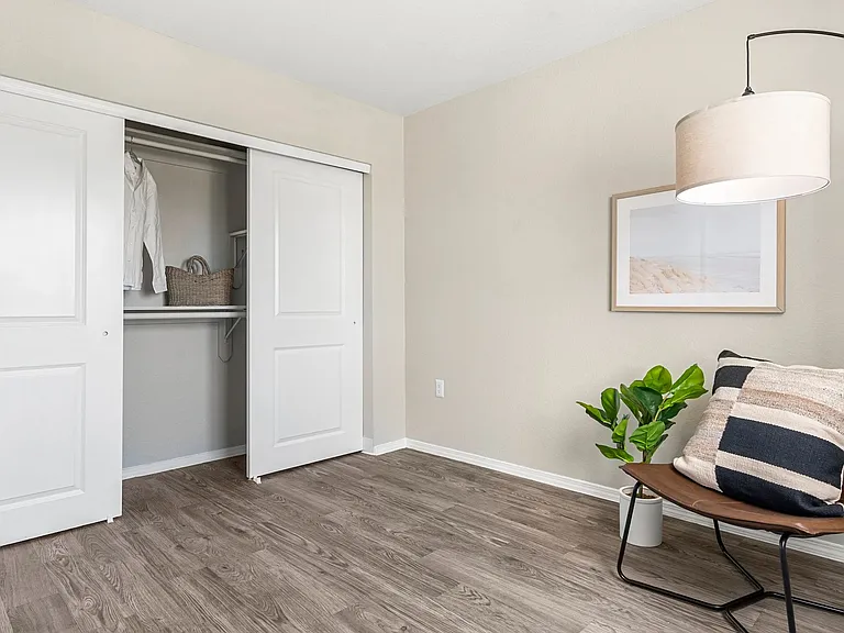 Step into your generous closet space, complete with sliding doors and the tidiest of shelving. It's organization made oh-so-easy!