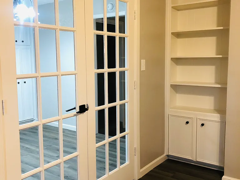 4th bed or office. French doors lock for privacy. Has closet and book shelves.