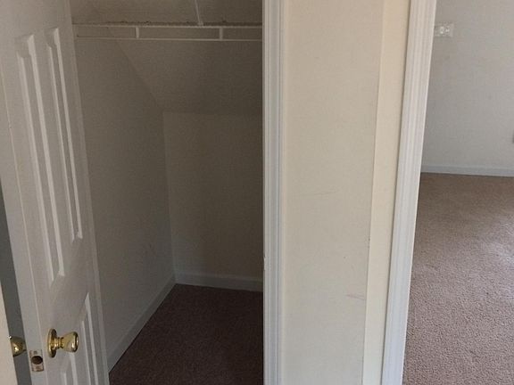 Downstairs shoe closet. NOTICE: carpet has been replaced with laminate wood floors