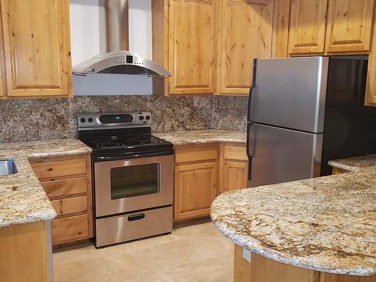 Outstanding full Kitchen with stainless appliances and Bar