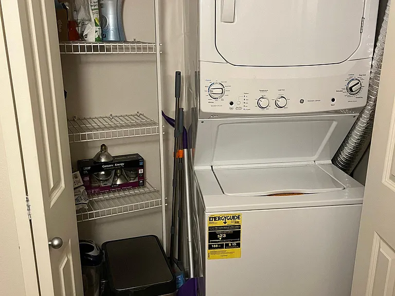 In-unit washer and dryer with storage.
