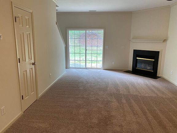 Living Room showing fireplace . Door leads to patio.