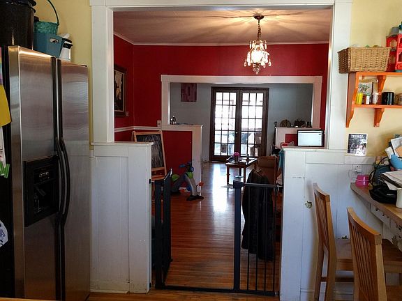 Kitchen, keyhole arch to dining room.