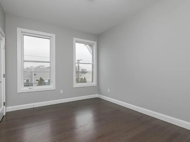 Bedroom #2. Fits a queen sized bed and dresser. Has custom California Closet design in closet.