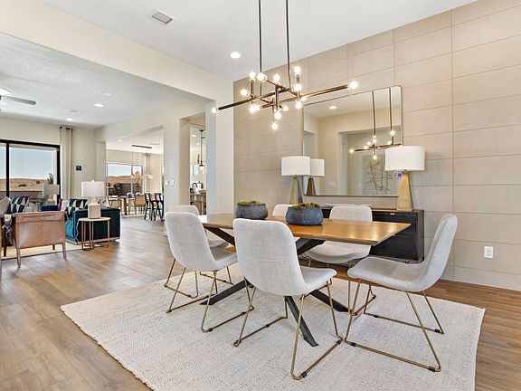 Added tile accented wall adds a level of elegance to the formal dining space.