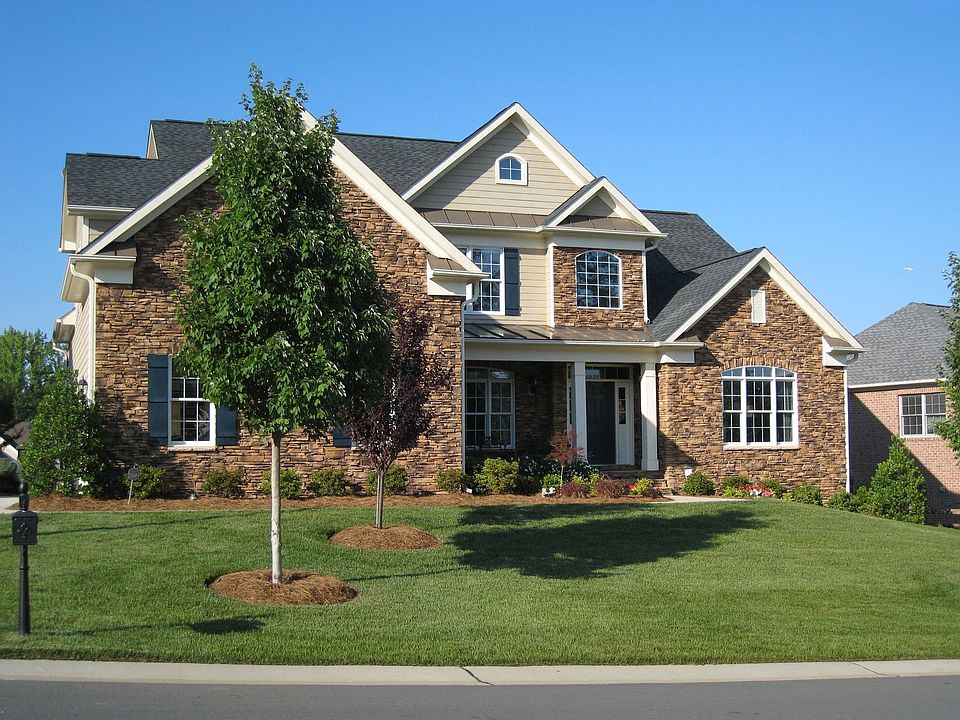 Beautiful Executive Home with Stone Front/Porch, 3 car garage, Unfin. Basement