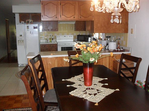 Dining Room with mirrored wall.