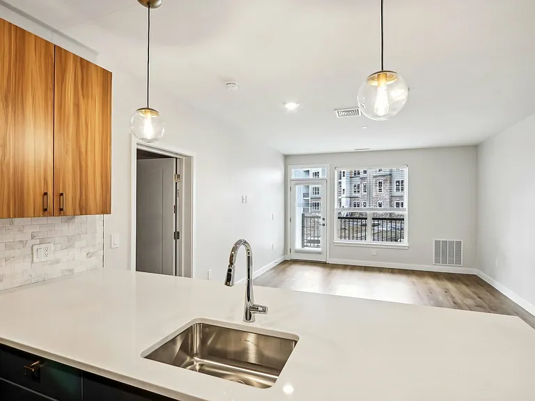 The Willow Floor Plan Kitchen Island and Living Room