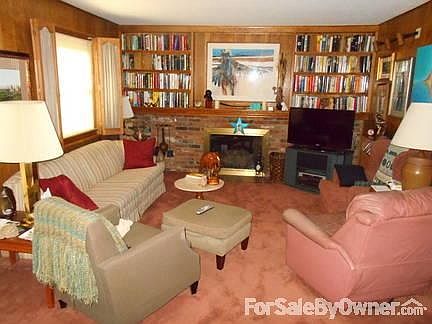 Family Room
						:
						Gas burning fireplace and built-in bookshelves.