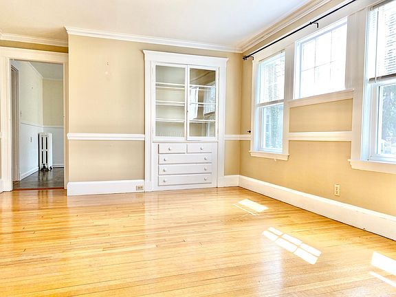 Dining room with lots of natural light includes a built in hutch. Could also be used as a playroom, office etc.